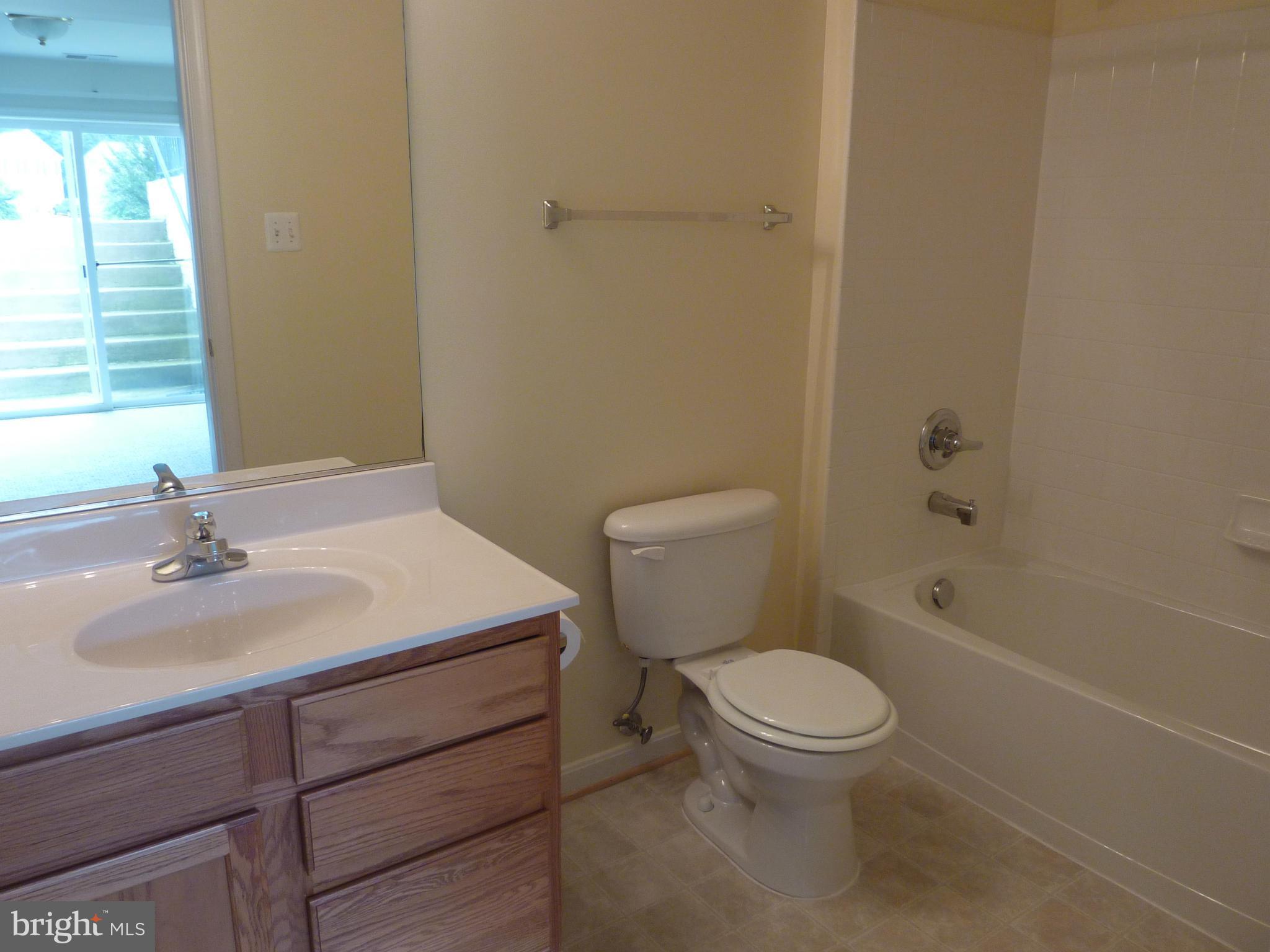 39 Hamstead Road Fredericksburg, VA 22405 - Photo 22 of 30 a bathroom with a sink a toilet and shower