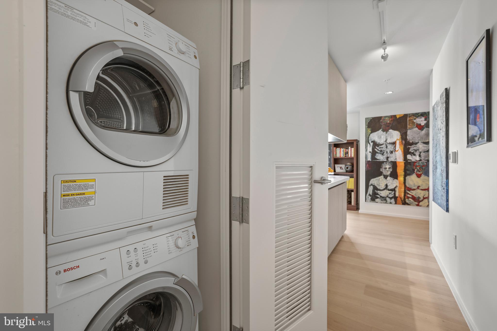 925 H Street Northwest, Unit 712 Washington, DC 20001 - Photo 23 of 54 a view of a hallway with washer and dryer