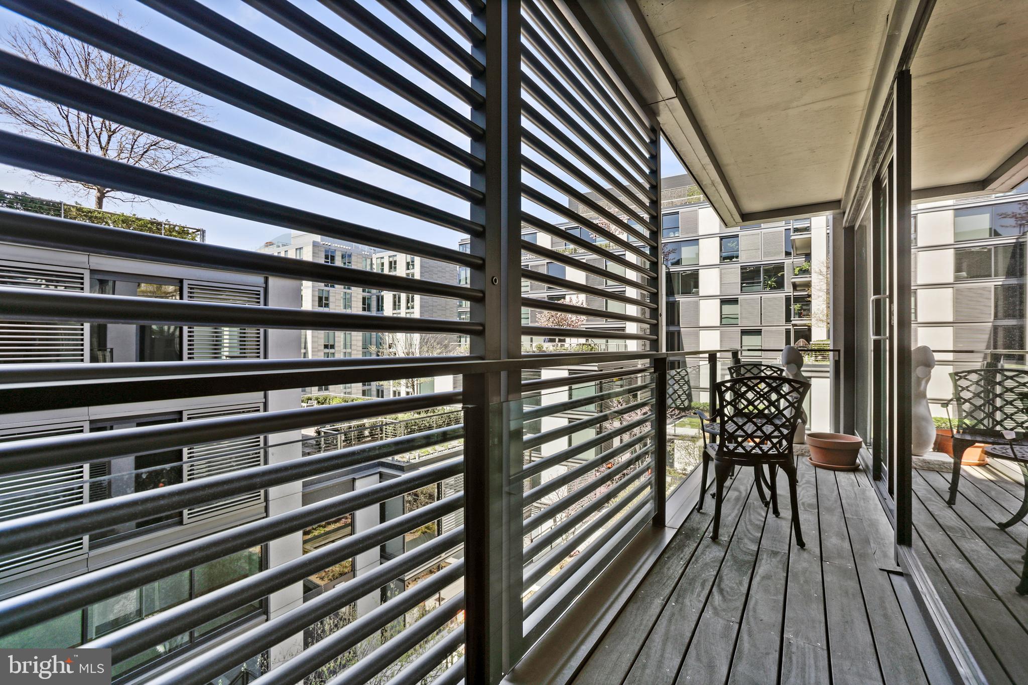 925 H Street Northwest, Unit 712 Washington, DC 20001 - Photo 25 of 54 a view of a balcony with wooden floor