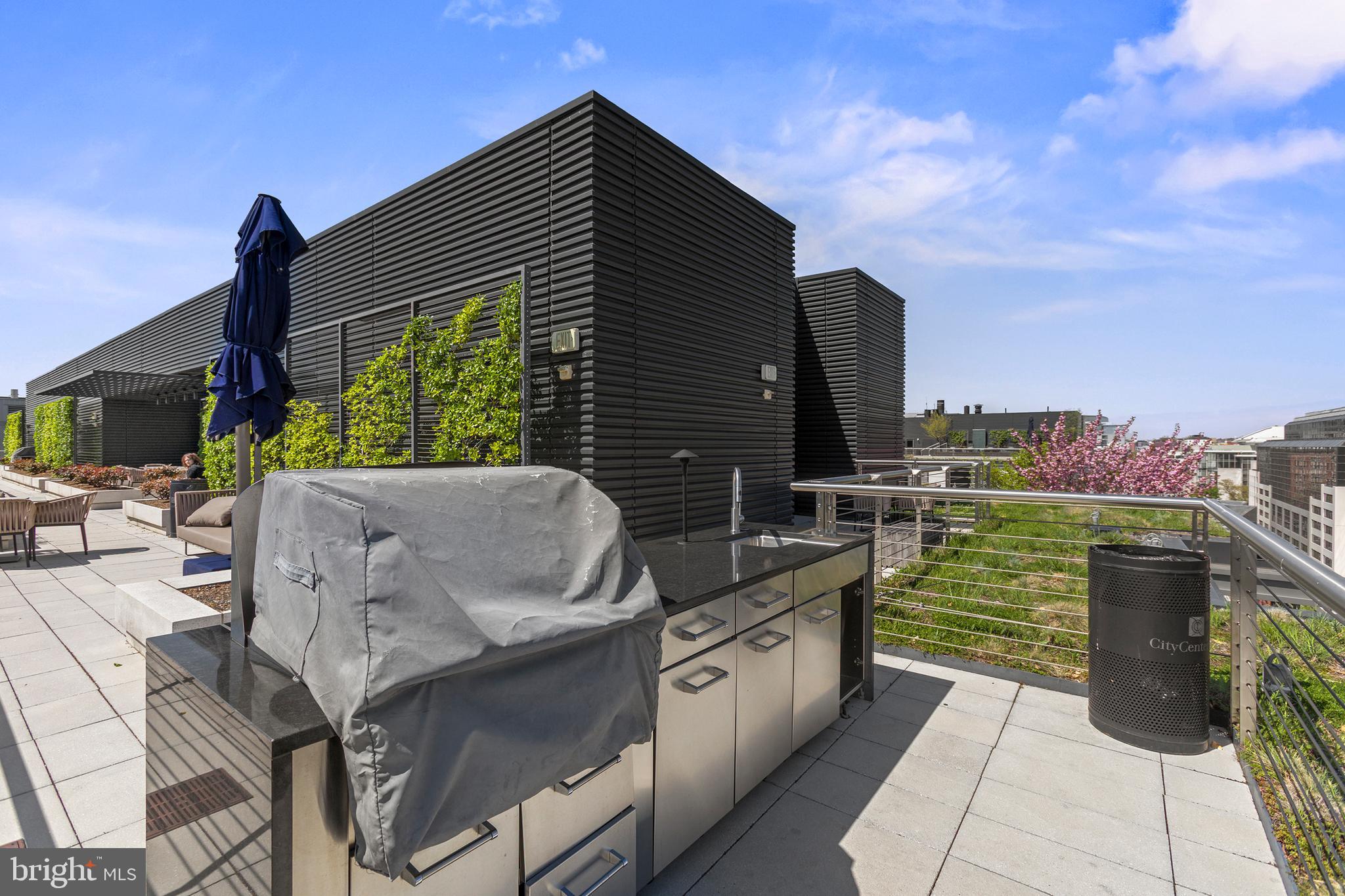 925 H Street Northwest, Unit 712 Washington, DC 20001 - Photo 32 of 54 a terrace with outdoor seating and city view