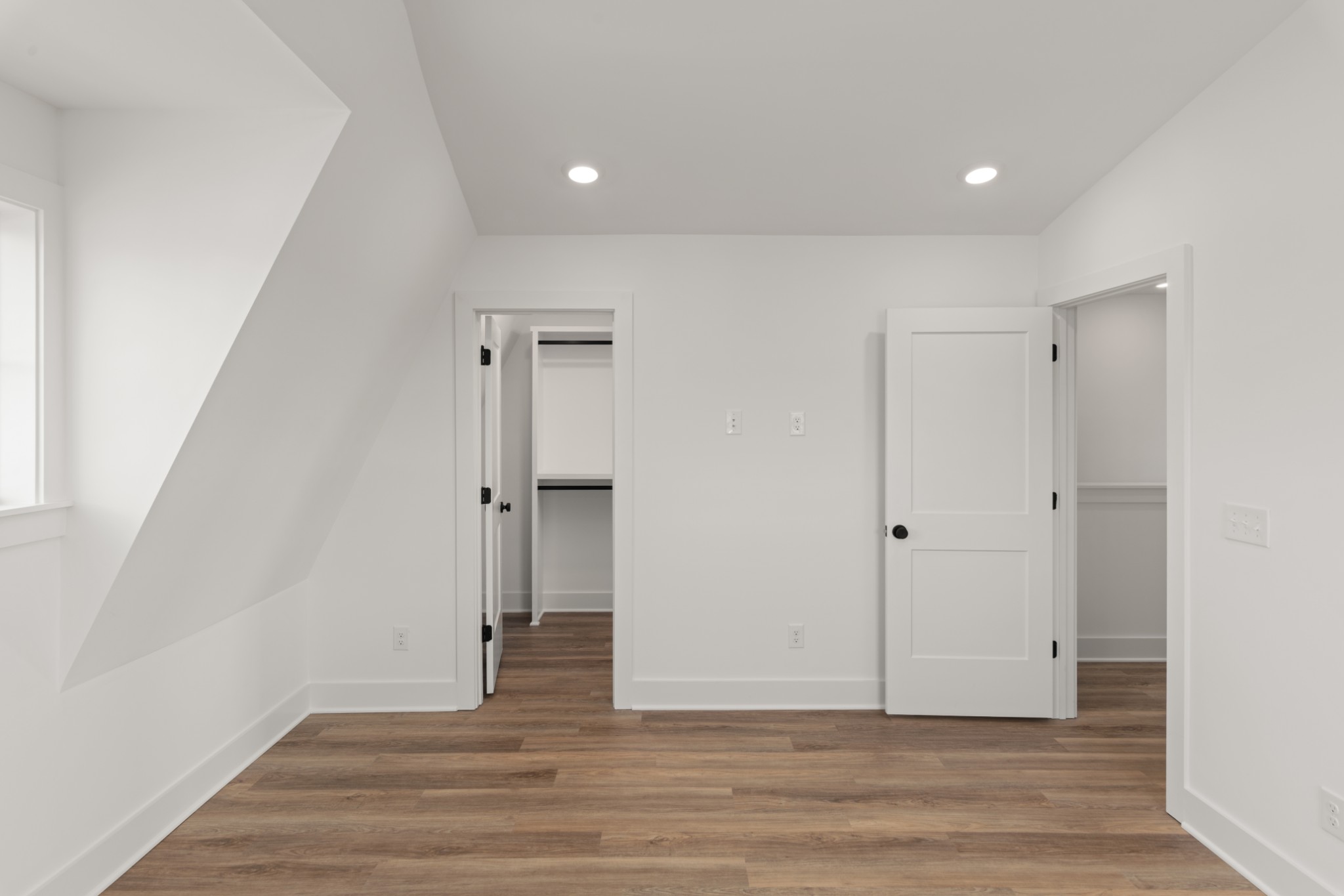 251 Nesbitt Lane Madison, TN 37115 - Photo 13 of 35 a view of an empty room with wooden floor and a window