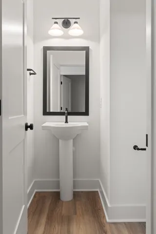 a bathroom with a sink and mirror