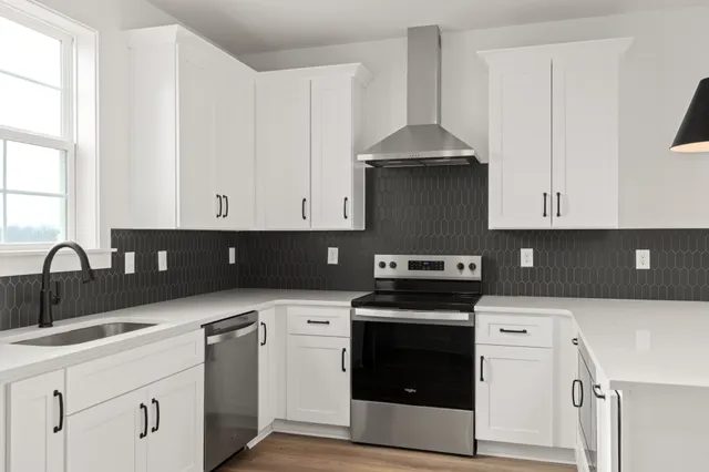 a kitchen with a sink and a stove