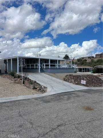 a view of a big yard and front of house