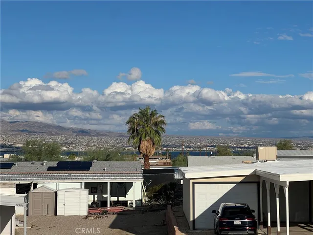 a view of a city street from a roof deck