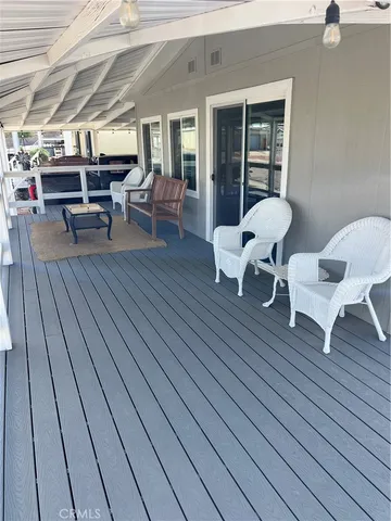 a outdoor space with wooden floor and furniture
