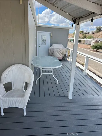 a view of balcony with wooden floor