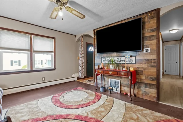 a bedroom with a bed and flat screen tv