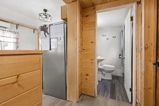 a bedroom with furniture and a chandelier