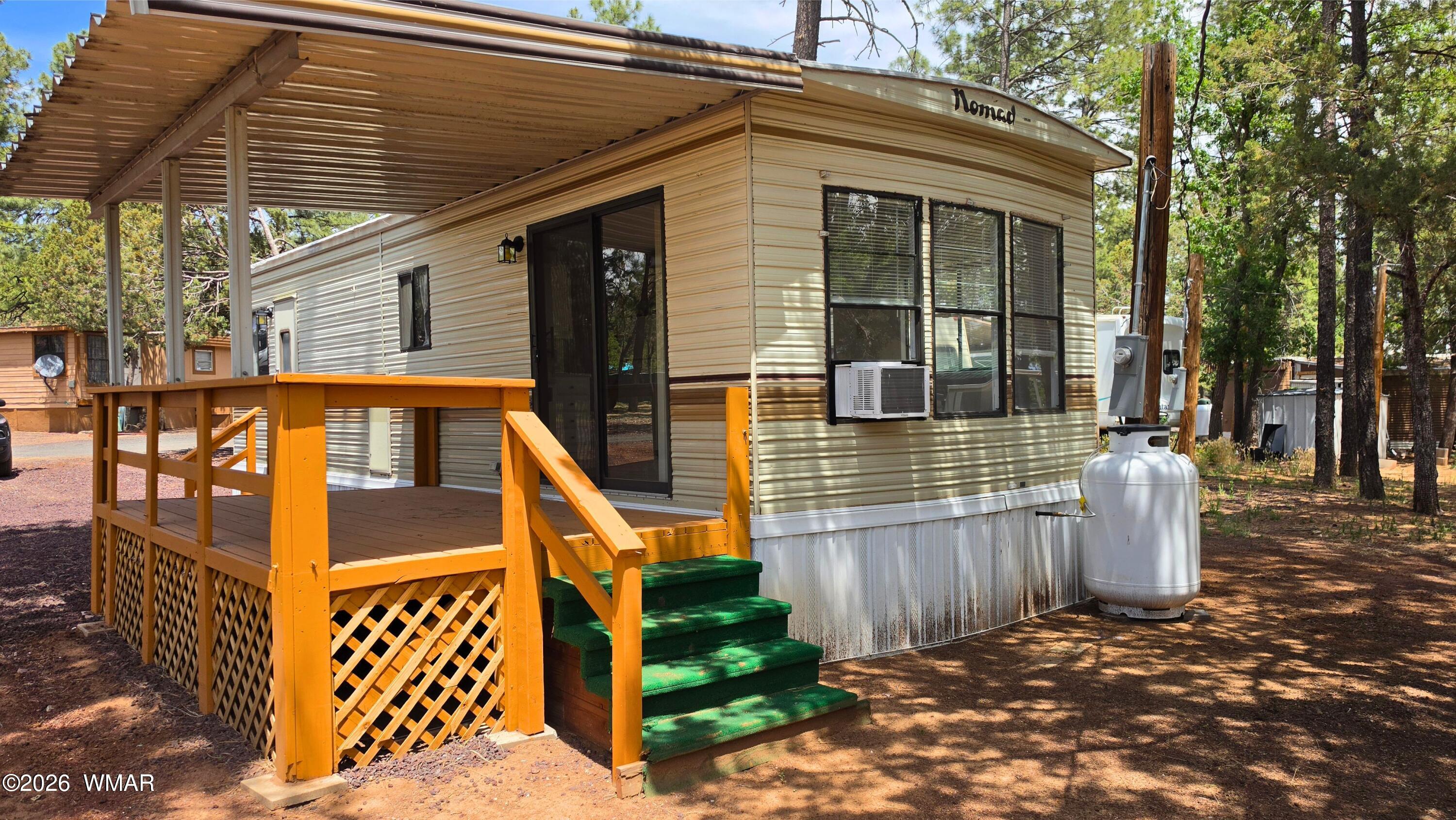 a view of a house with wooden fence