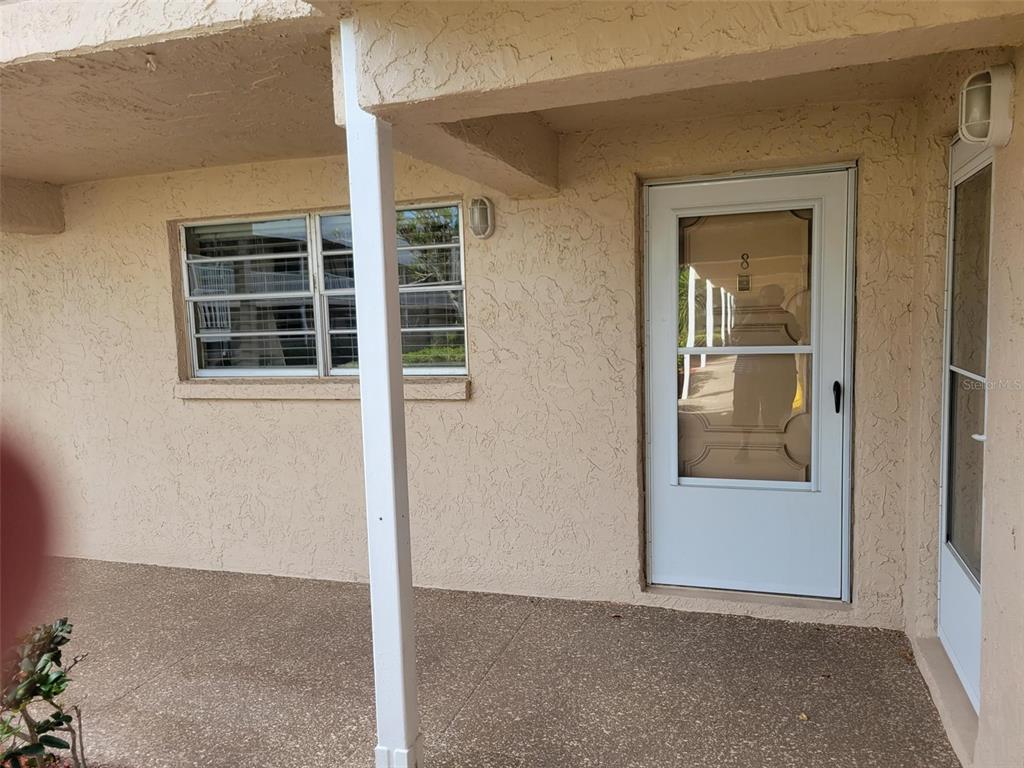 10032 65th Avenue North, Unit 8 St. Petersburg, FL 33708 - Photo 27 of 61 an empty room with windows