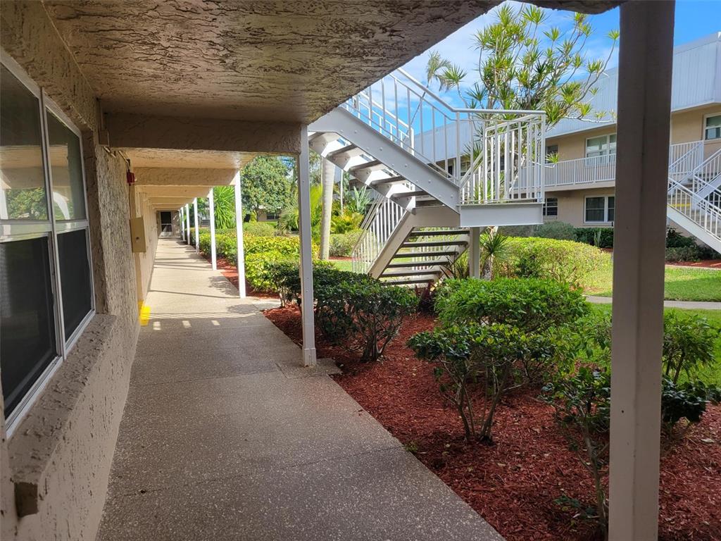 10032 65th Avenue North, Unit 8 St. Petersburg, FL 33708 - Photo 29 of 61 a view of porch with seating space