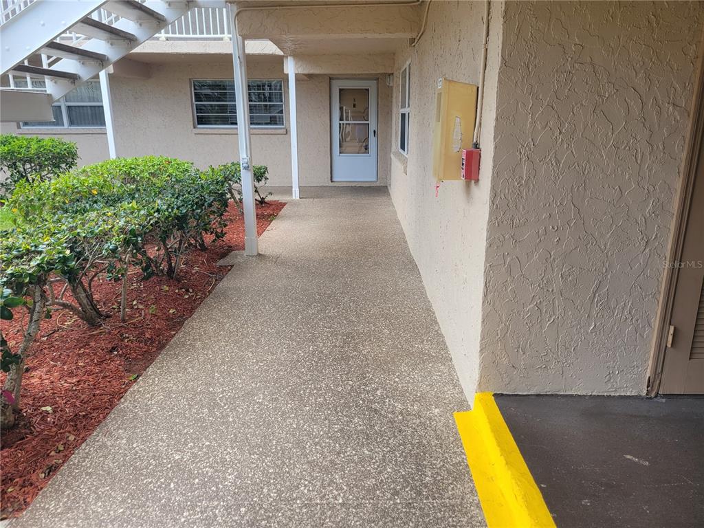 10032 65th Avenue North, Unit 8 St. Petersburg, FL 33708 - Photo 55 of 61 a view of a house with a swimming pool