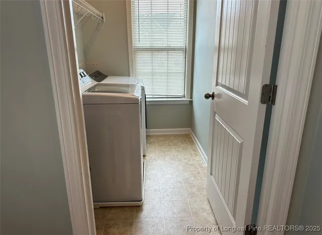 a utility room with a window dryer and washer