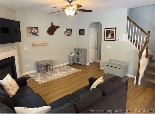 a bedroom with furniture and a flat screen tv