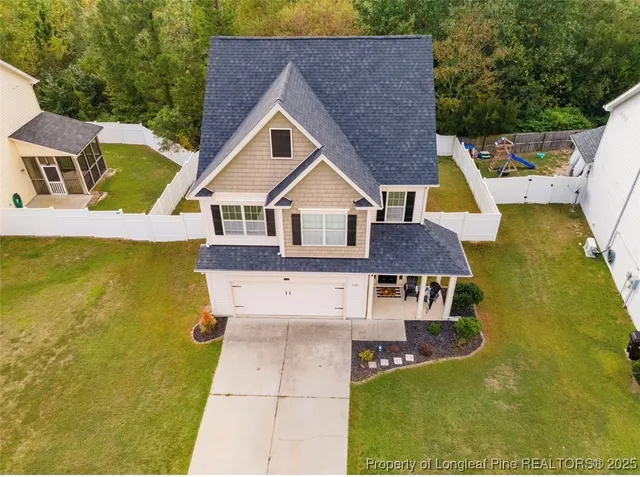a aerial view of a house with swimming pool