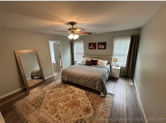 a bedroom with a bed and a mirror