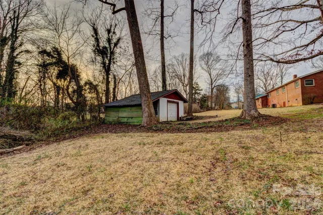 a backyard of a house with lots of green space