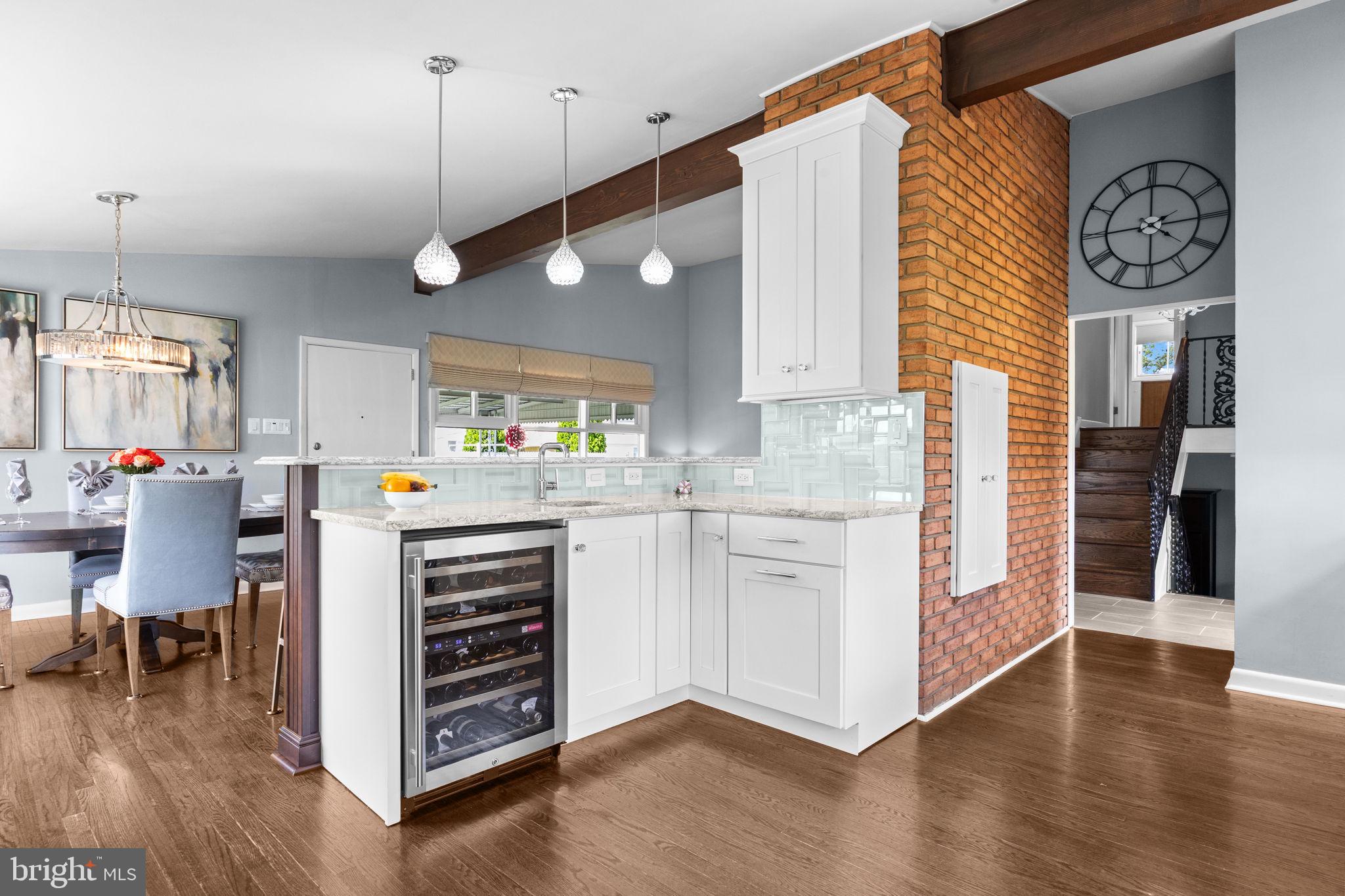 3166 Hulmeville Road Bensalem, PA 19020 - Photo 11 of 40 a kitchen with a refrigerator cabinets and wooden floor