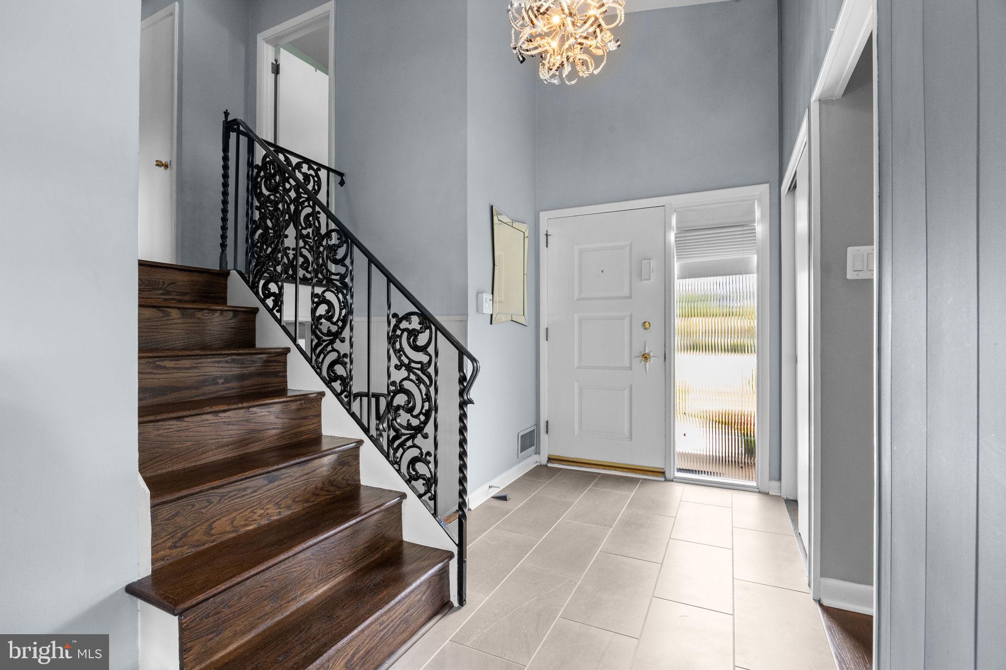 3166 Hulmeville Road Bensalem, PA 19020 - Photo 13 of 40 a view of entryway and hall with wooden floor