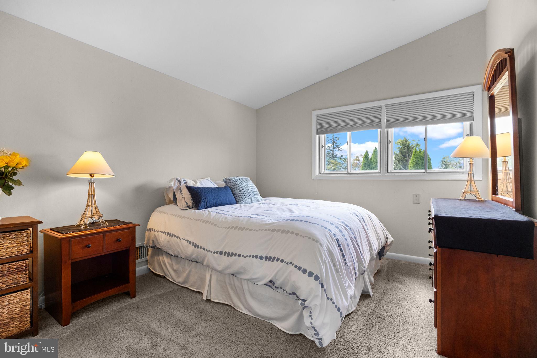 3166 Hulmeville Road Bensalem, PA 19020 - Photo 14 of 40 a bed room with a bed and a lamp