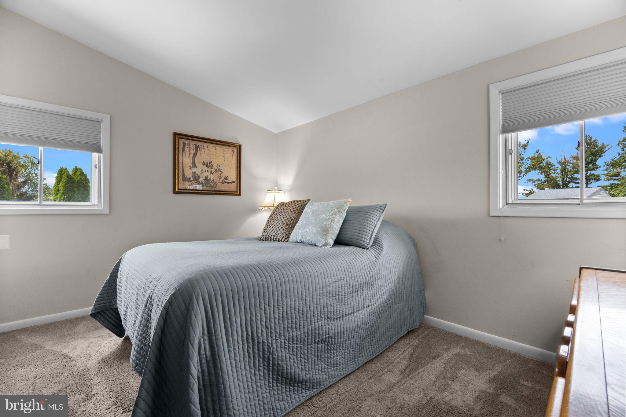 3166 Hulmeville Road Bensalem, PA 19020 - Photo 15 of 40 a bedroom with a bed and a painting on the wall