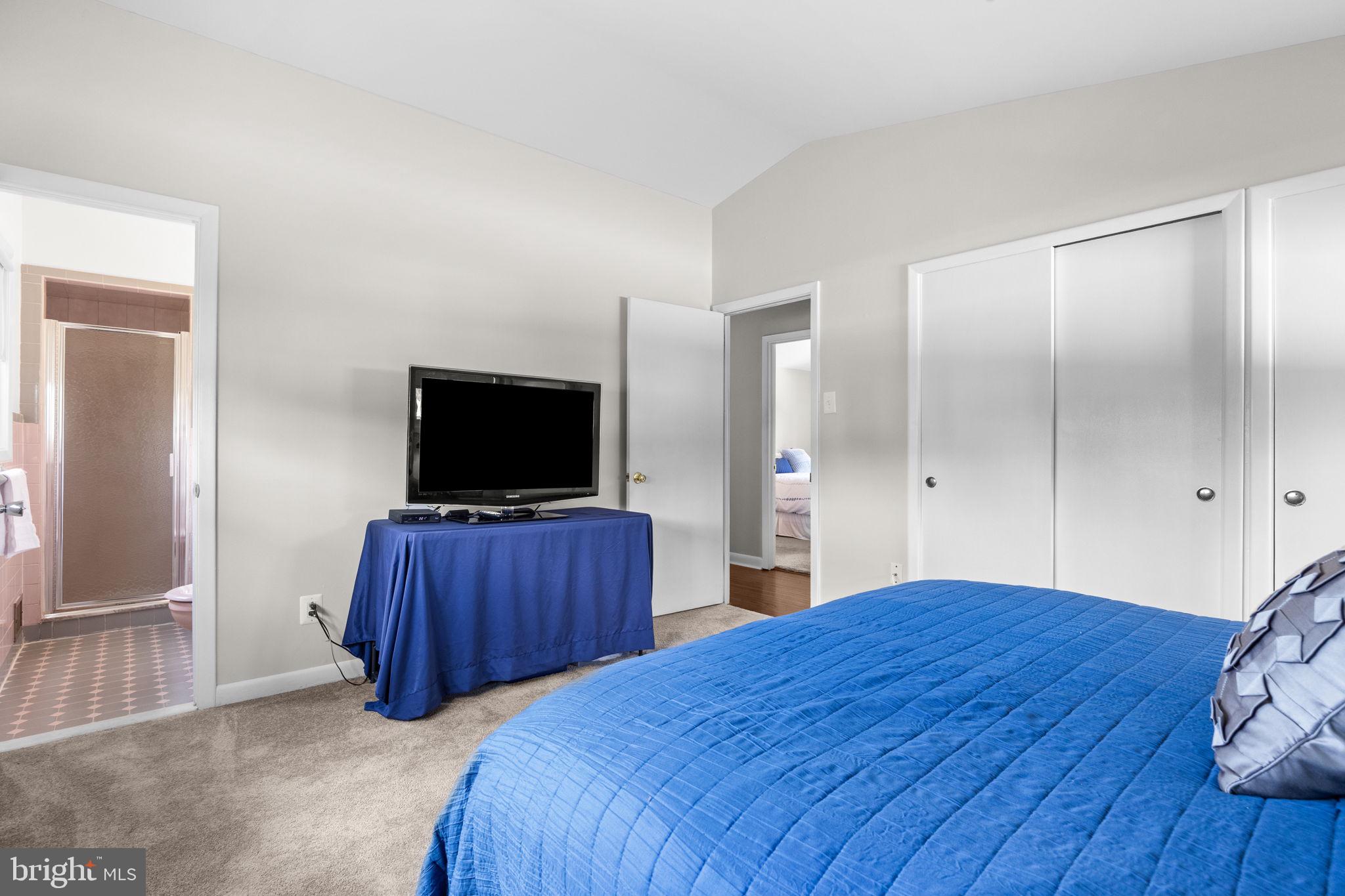 3166 Hulmeville Road Bensalem, PA 19020 - Photo 17 of 40 a bedroom with a bed and a flat screen tv