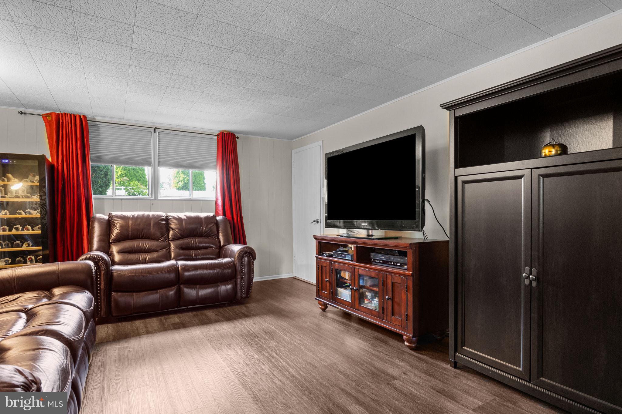 3166 Hulmeville Road Bensalem, PA 19020 - Photo 22 of 40 a living room with furniture and a flat screen tv