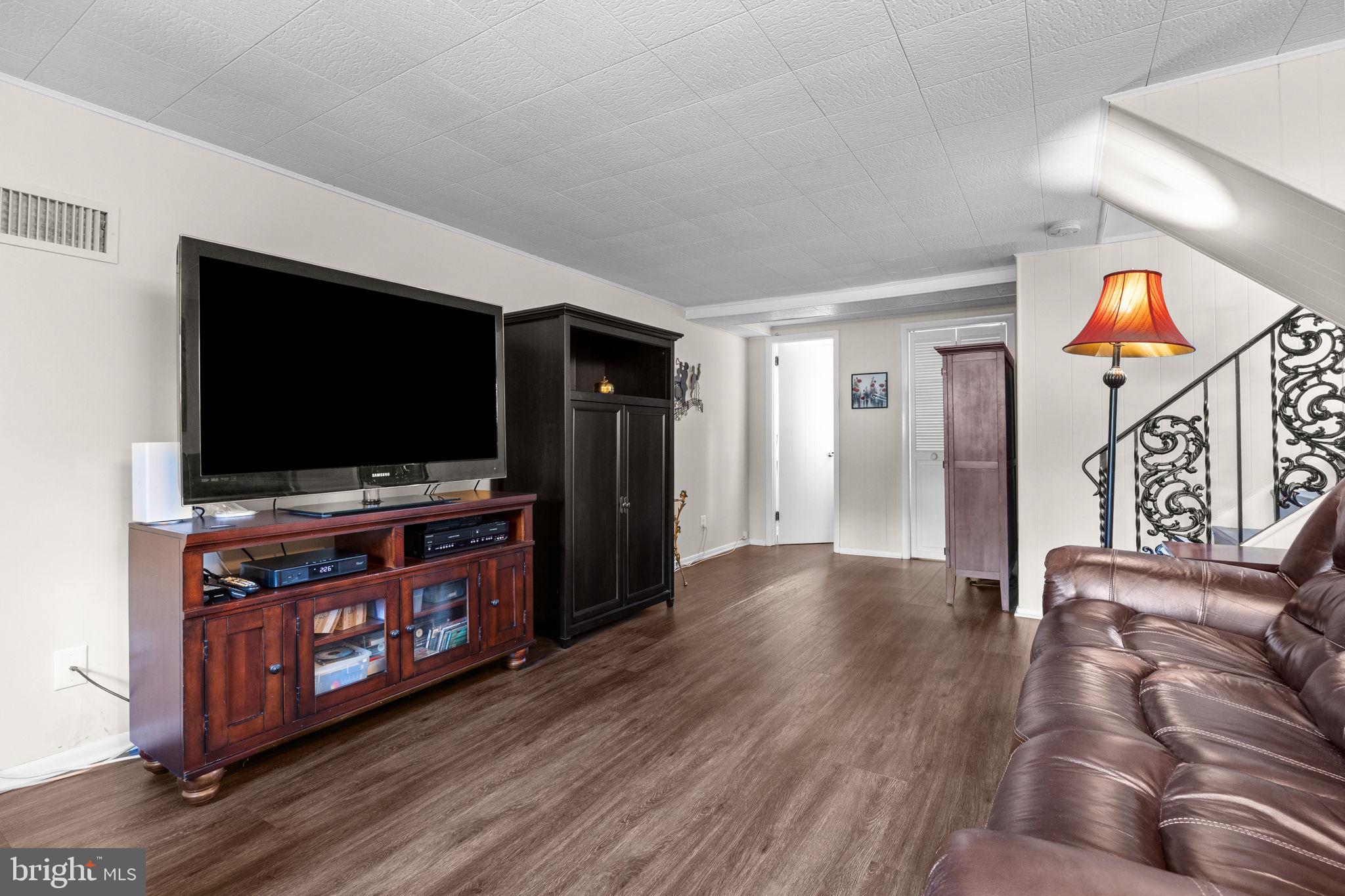 3166 Hulmeville Road Bensalem, PA 19020 - Photo 24 of 40 a living room with furniture and a flat screen tv