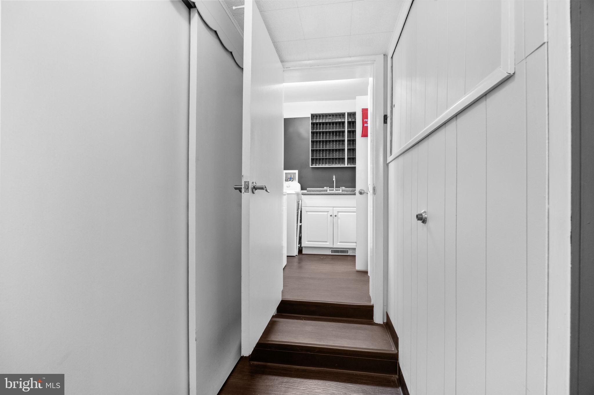 3166 Hulmeville Road Bensalem, PA 19020 - Photo 27 of 40 a view of a hallway with wooden floor and staircase
