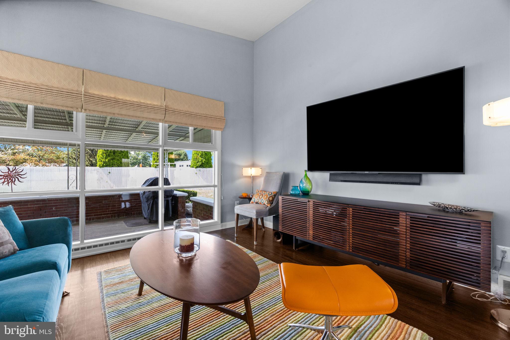 3166 Hulmeville Road Bensalem, PA 19020 - Photo 4 of 40 a living room with furniture and a flat screen tv