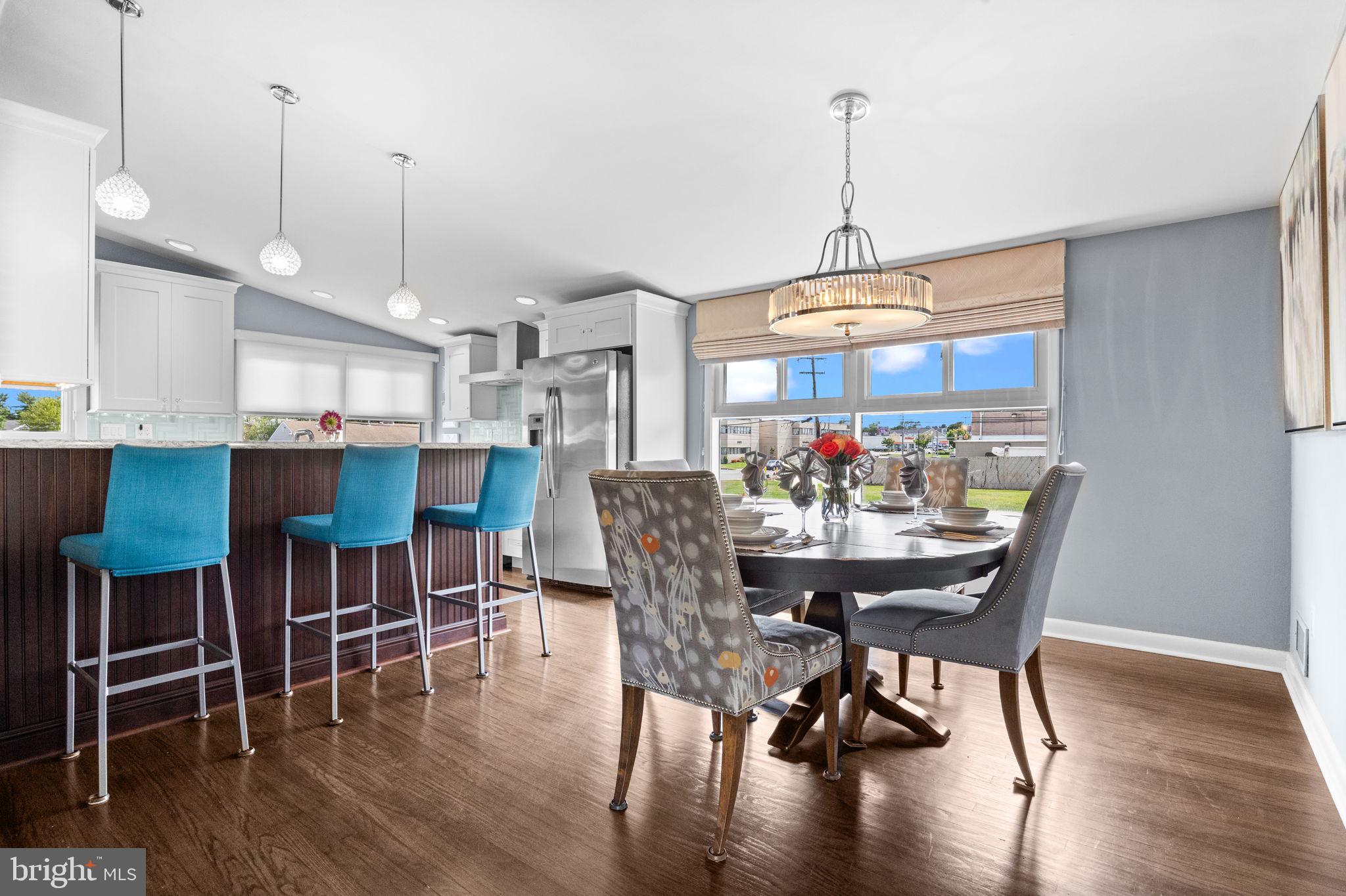 3166 Hulmeville Road Bensalem, PA 19020 - Photo 6 of 40 a dining room with furniture window wooden floor and a chandelier