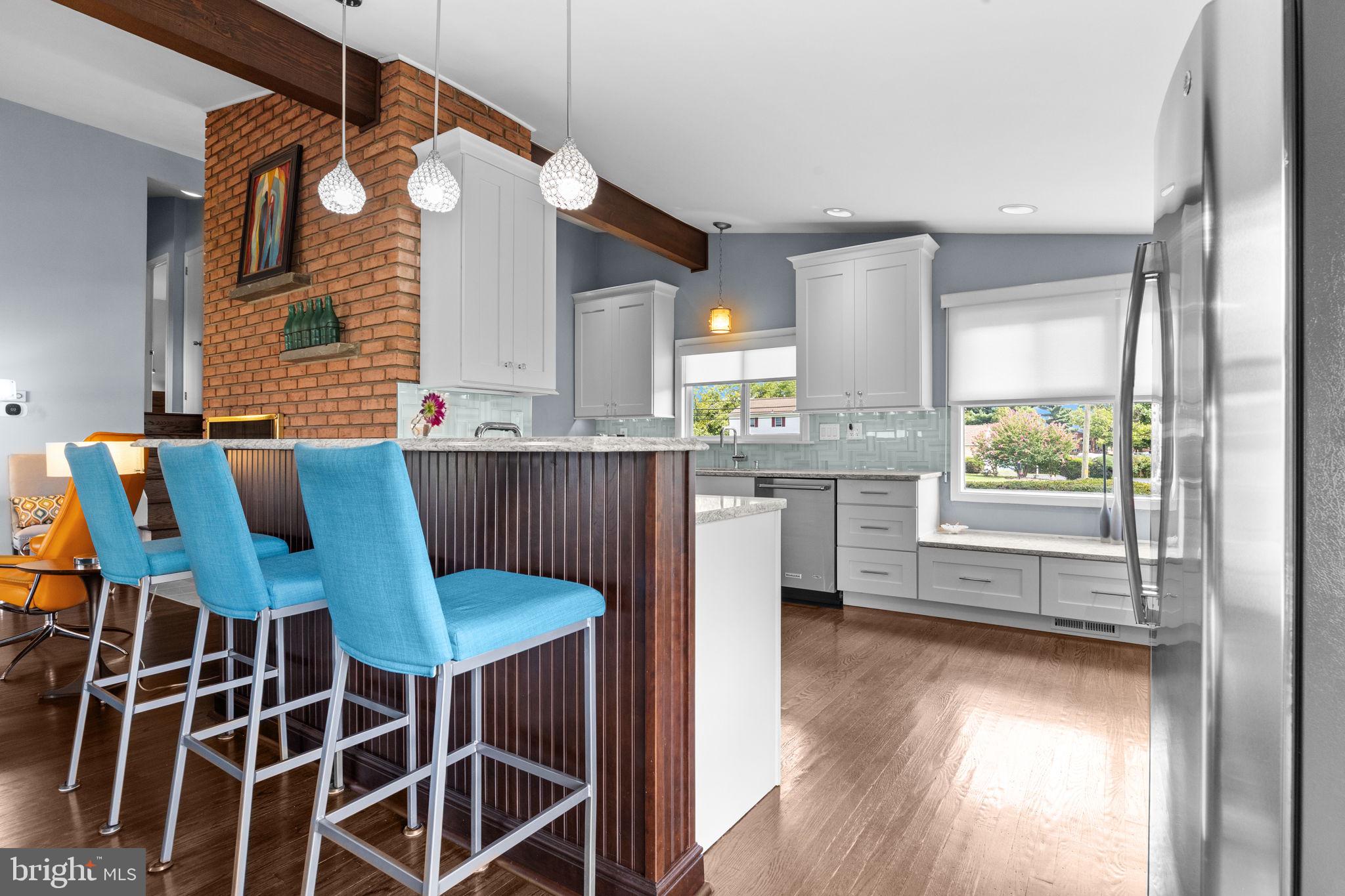 3166 Hulmeville Road Bensalem, PA 19020 - Photo 7 of 40 a kitchen with a table chairs and a window