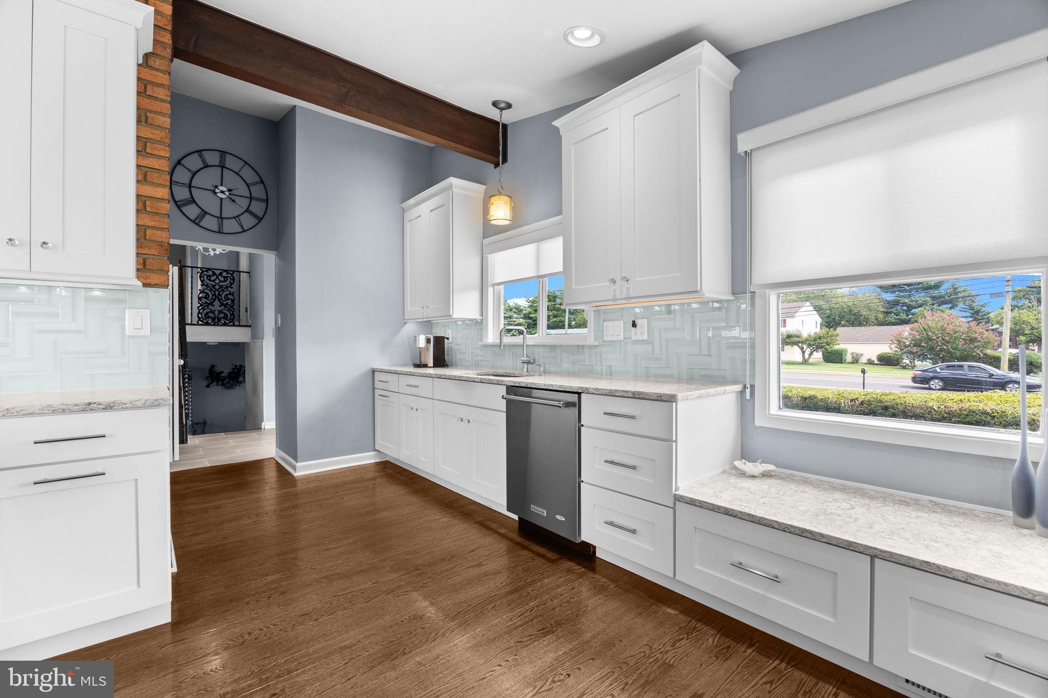 3166 Hulmeville Road Bensalem, PA 19020 - Photo 8 of 40 a kitchen with granite countertop white cabinets and white appliances