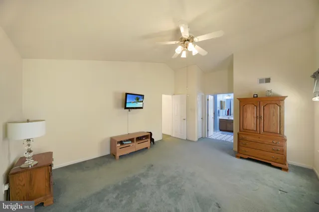 a bathroom with a sink vanity granite and a mirror