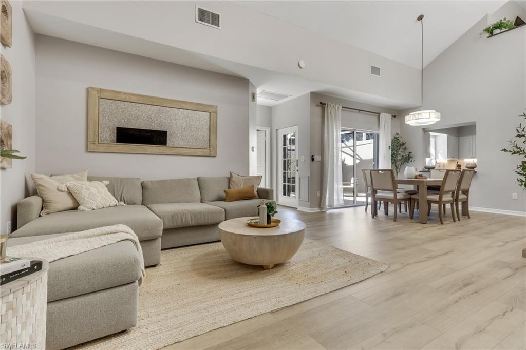 4536 Court Way, Unit 19D Naples, FL 34109 - Photo 1 of 27 a living room with furniture and a dining table