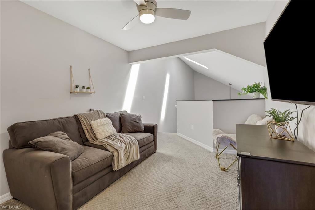 4536 Court Way, Unit 19D Naples, FL 34109 - Photo 14 of 27 a living room with furniture and a flat screen tv