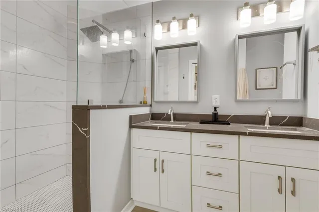 a bathroom with a sink and a mirror