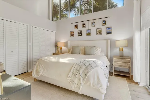 a bedroom with a bed and a night stand