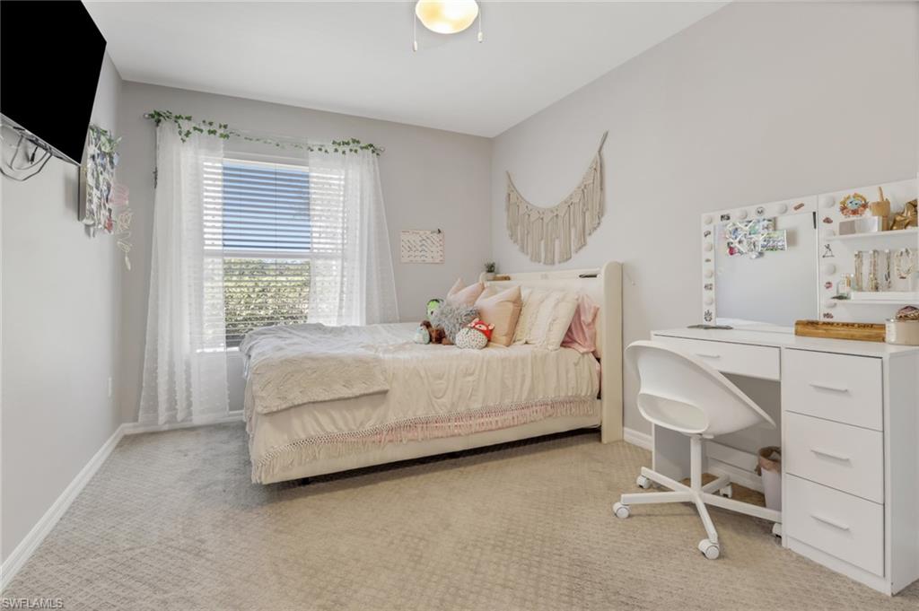 4536 Court Way, Unit 19D Naples, FL 34109 - Photo 20 of 27 a bedroom with a bed and a window