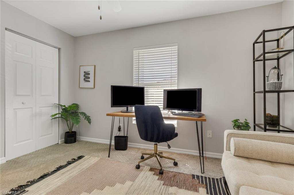 4536 Court Way, Unit 19D Naples, FL 34109 - Photo 22 of 27 a living room with furniture and a flat screen tv