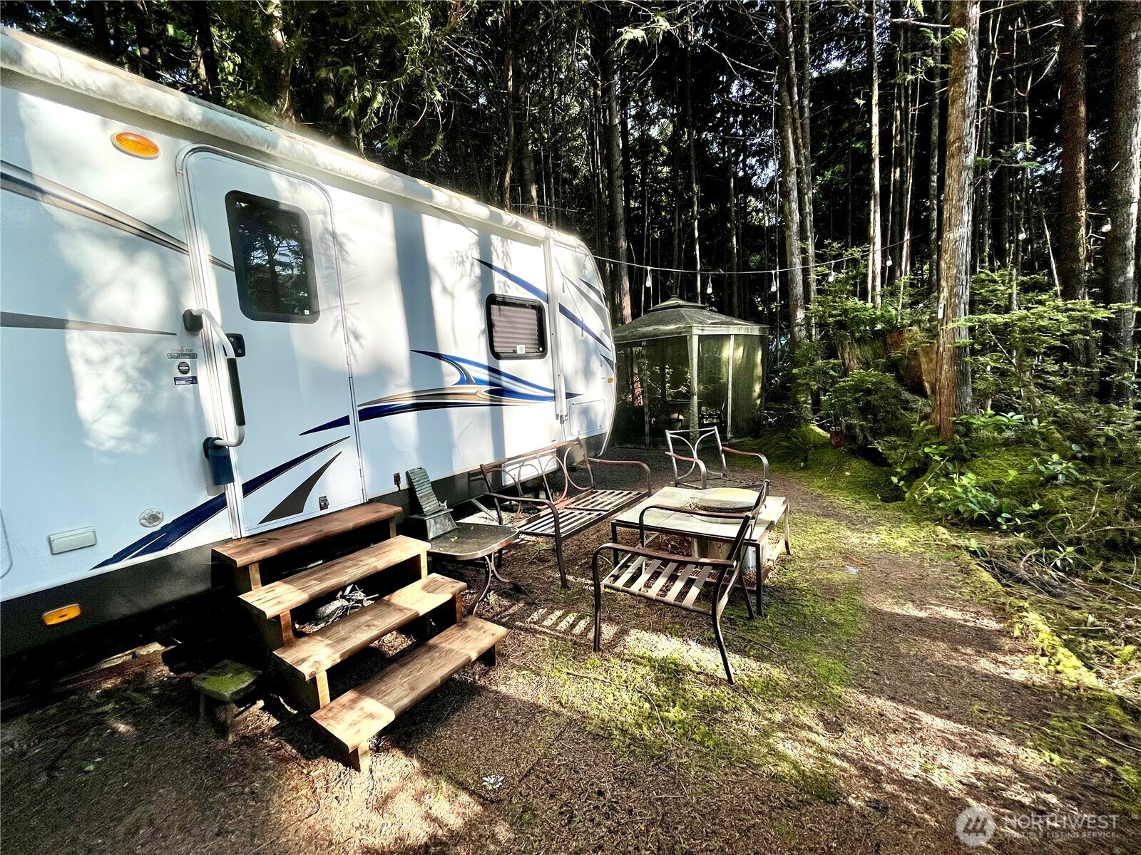 56 Butterfly Lane Pacific Beach, WA 98571 - Photo 14 of 29 a bench is sitting in middle of a yard