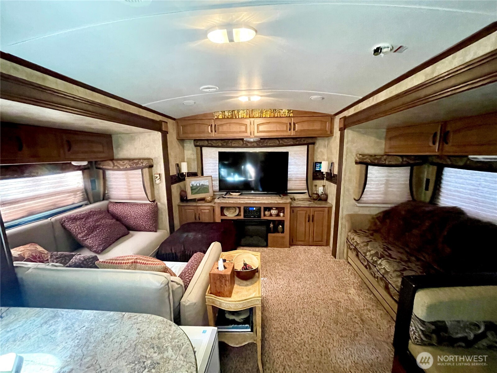 56 Butterfly Lane Pacific Beach, WA 98571 - Photo 15 of 29 a living room with furniture and a flat screen tv