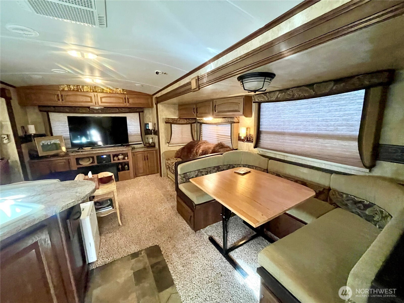 56 Butterfly Lane Pacific Beach, WA 98571 - Photo 19 of 29 a room with furniture and flat screen tv