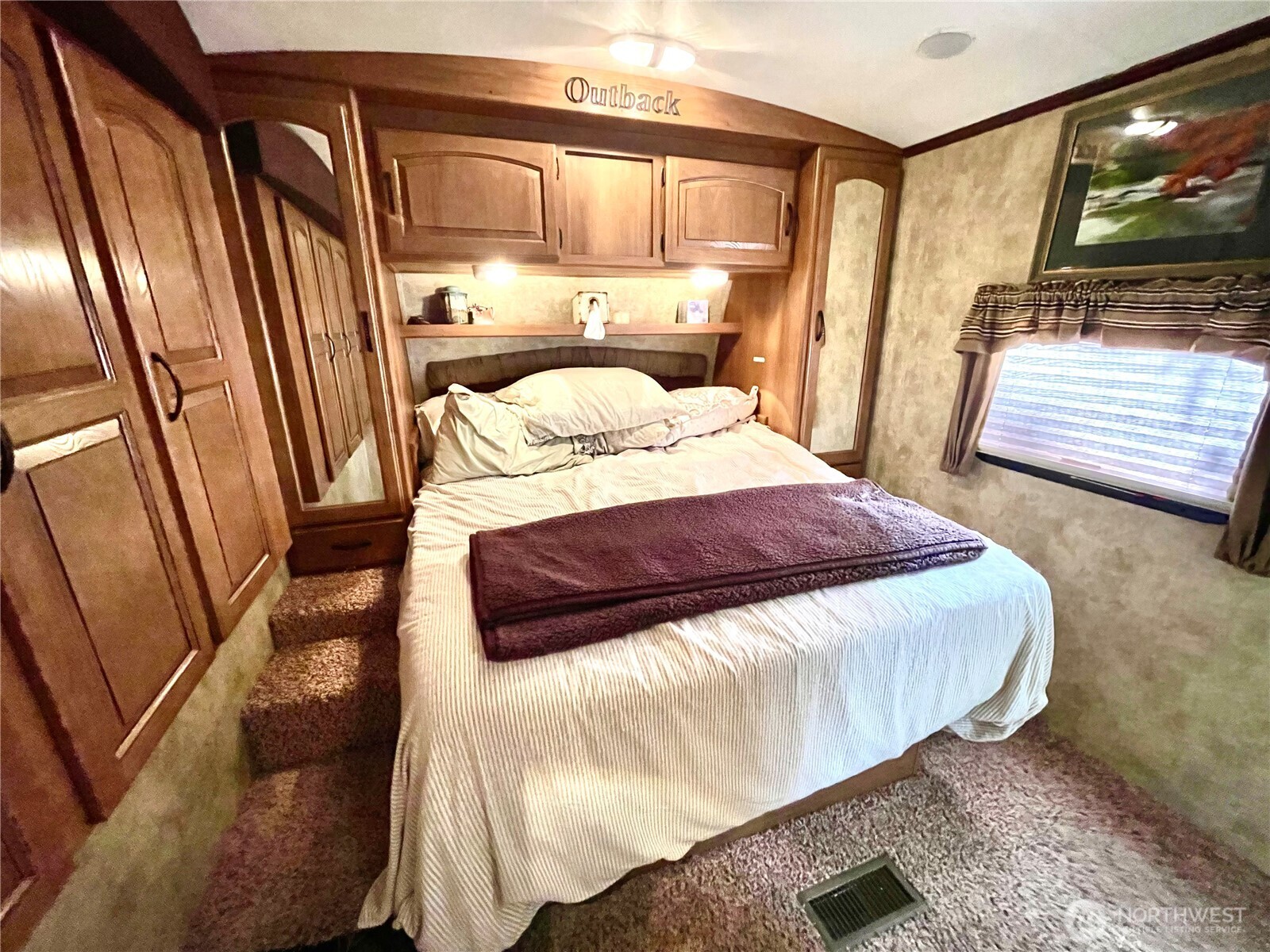 56 Butterfly Lane Pacific Beach, WA 98571 - Photo 25 of 29 a bedroom with a bed and a flat tv screen on dresser