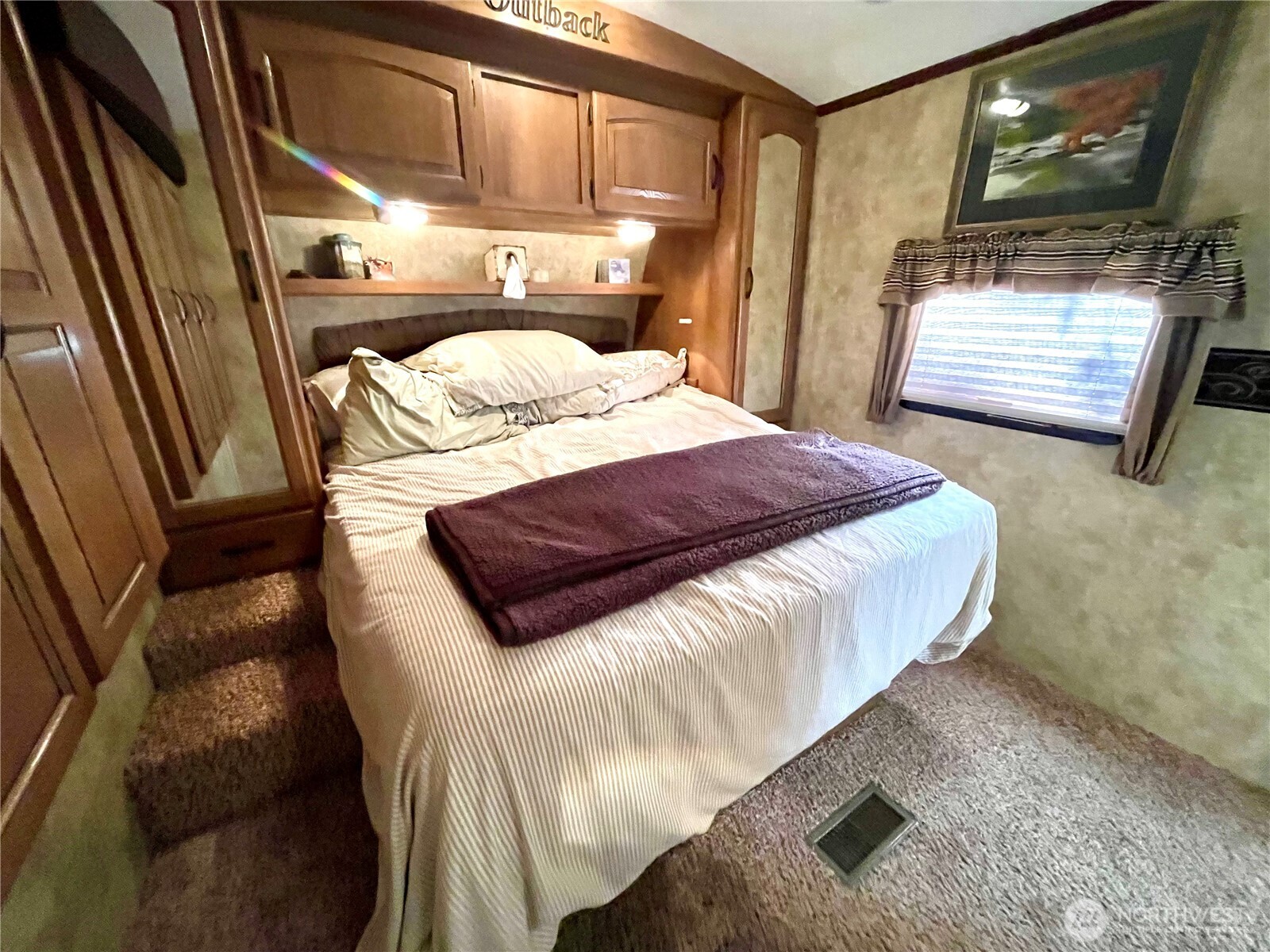 56 Butterfly Lane Pacific Beach, WA 98571 - Photo 27 of 29 a bedroom with a bed and wooden floor