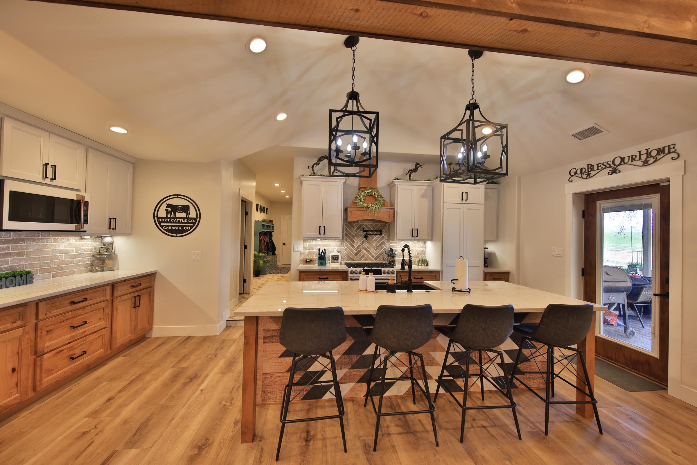 58749 Oe Road Collbran, CO 81624 - Photo 8 of 42 a view of a dining room with furniture window and wooden floor