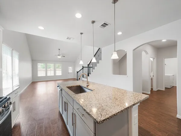 a kitchen with sink and stove