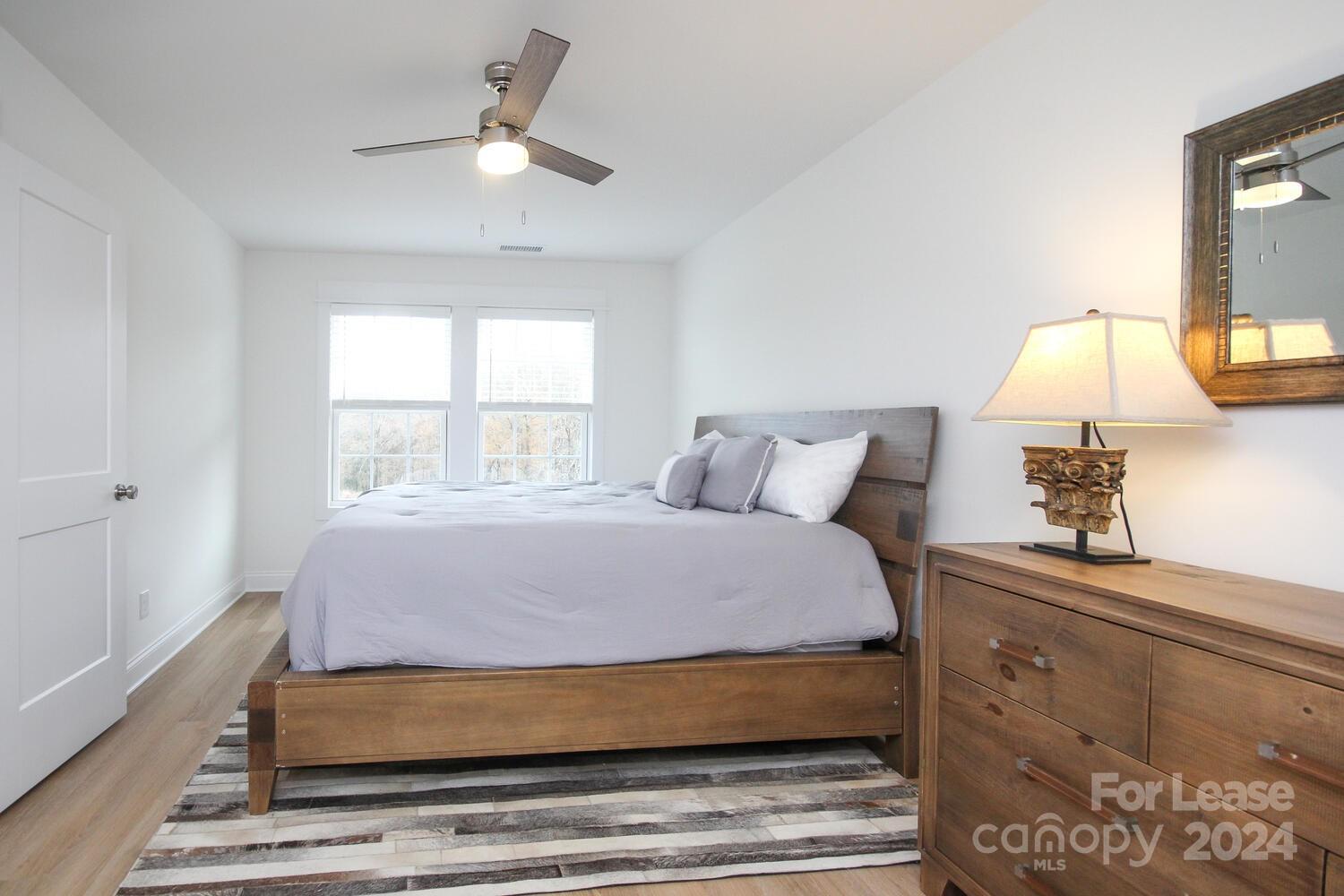 1088 Startown Road Lincolnton, NC 28092 - Photo 26 of 48 a bedroom with a bed and window with lamp