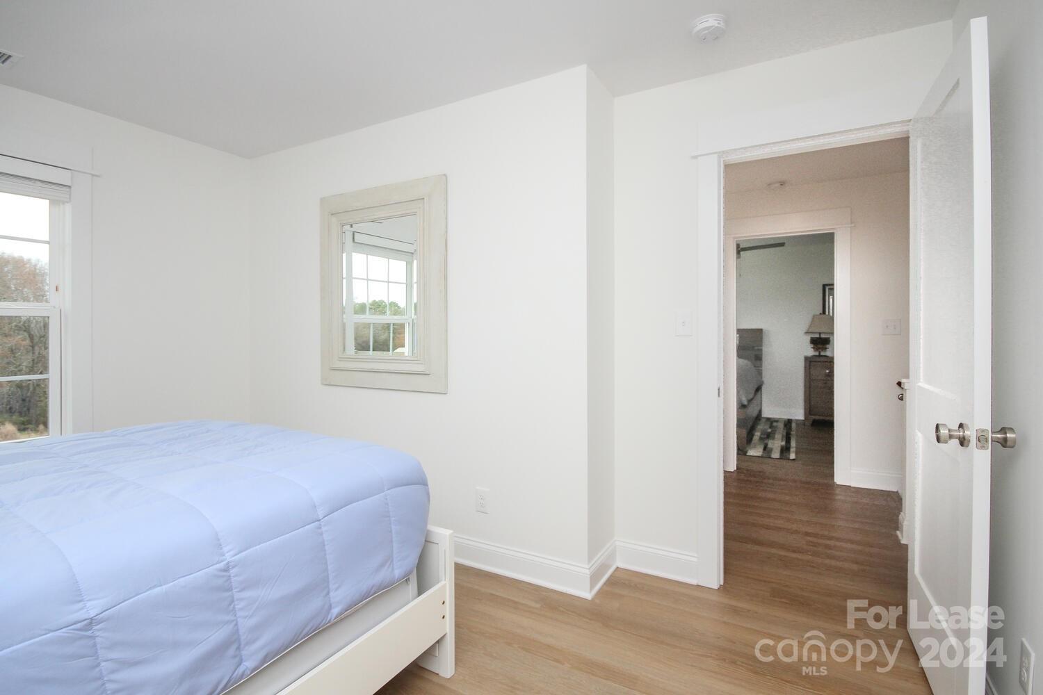 1088 Startown Road Lincolnton, NC 28092 - Photo 37 of 48 a bedroom with a bed and wooden floor